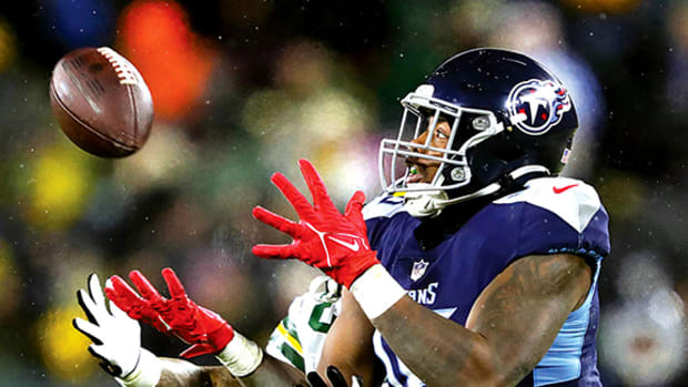 Tennessee Titans wide receiver Treylon Burks catches a pass against Green Bay.